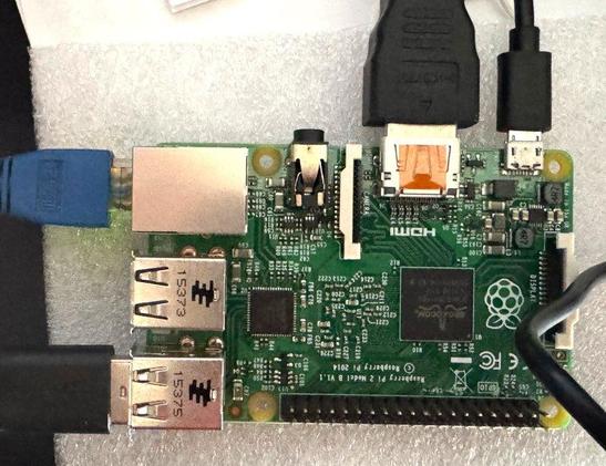 photo of a raspberry pi 2 with cables connected